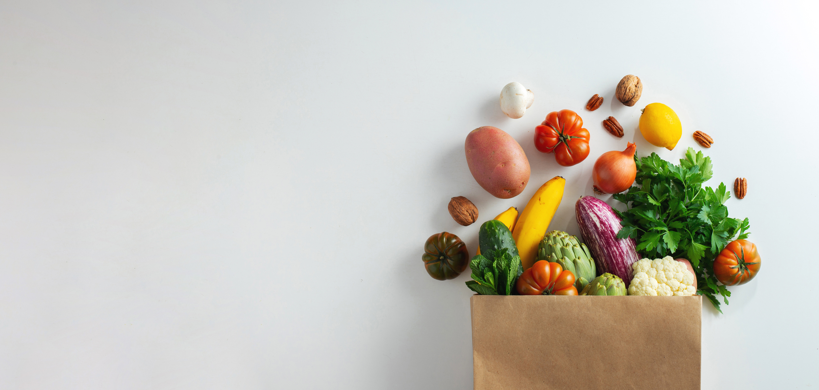 Fruits and Vegetables Spilling from Paper Bag 